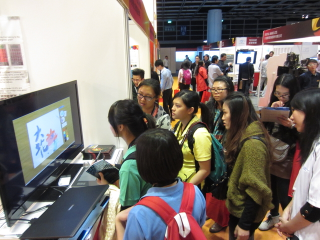 Visitors having hands-on experience in using Moxi (1)